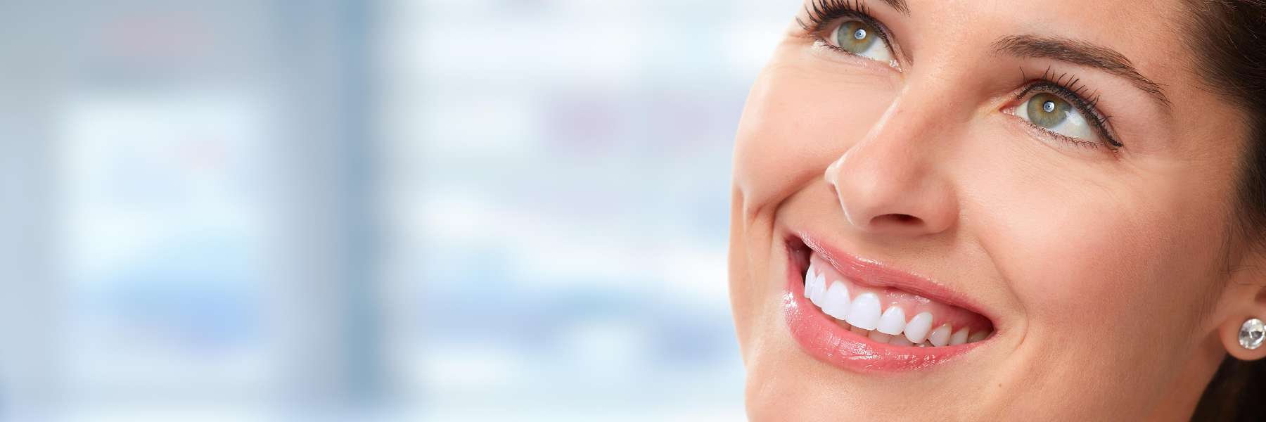 A smiling woman looking up | dentist Brandon FL