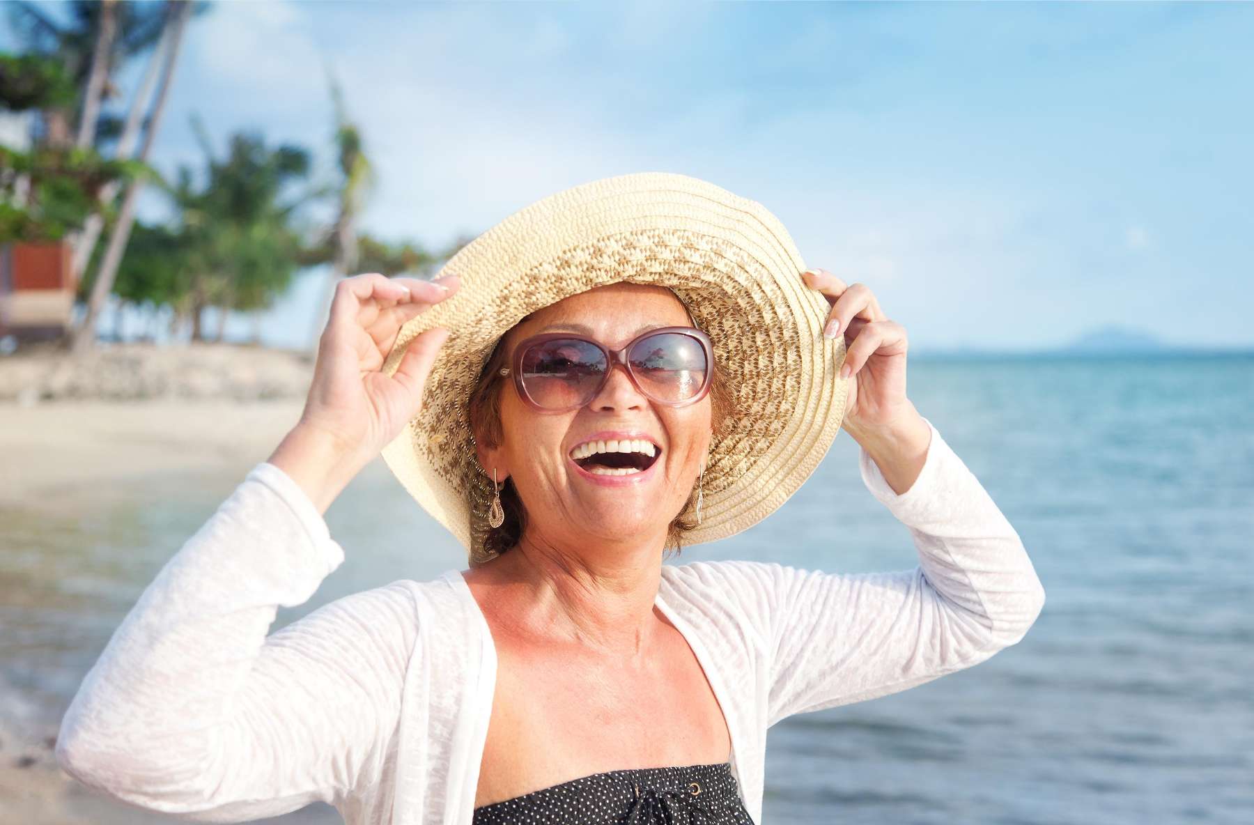 A smiling woman on the beach in Brandon, FL